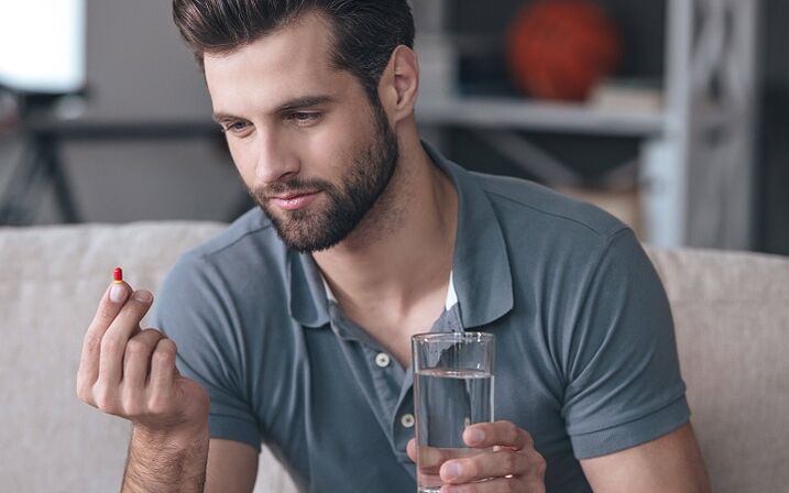 a man drinks a penis enlargement pill