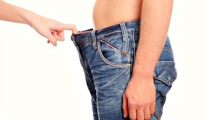 a woman peeks into a man’s pants with increased soda for a penis